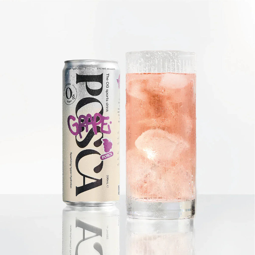 Grape juice can and glass with pink liquid on a white background